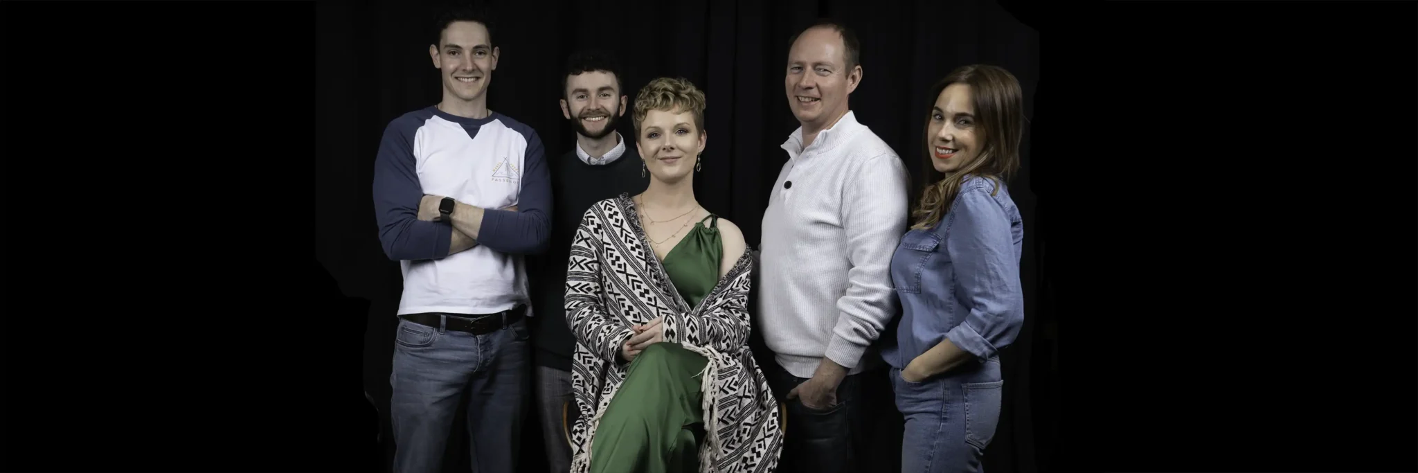 A group photo of 5 people standing together. They are staff at a video production company Vermillion Films