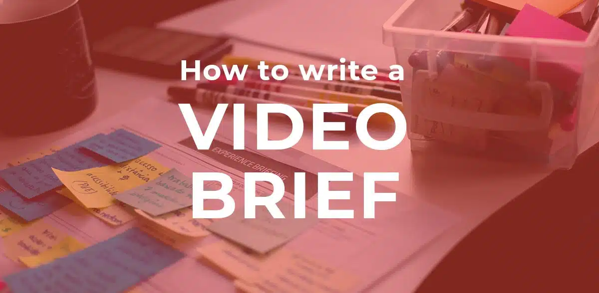 image of pens, paper and post its with text "how to write a video brief" overlaid by Vermillion Films Video Production Company Birmingham